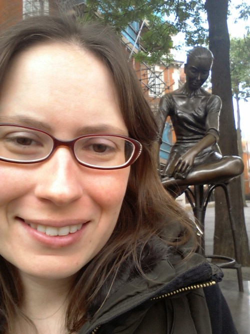 Me in London last summer, with my favorite statue, which inspired one of the characters in my book.